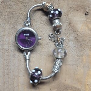 18 Ladies Bella watch purple dial and Pandora style bracelet.